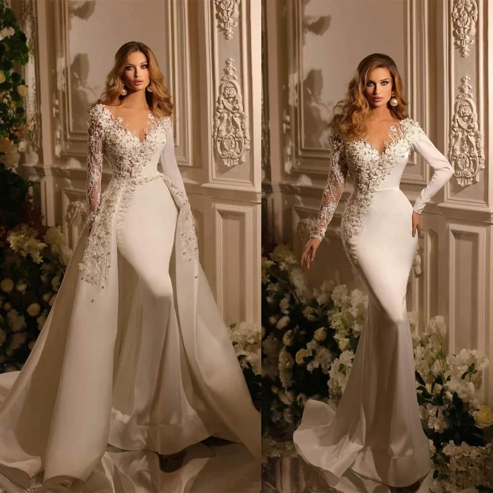 Custom mermaid wedding dresses with V neckline, long sleeves, pearl applications and removable skirts.