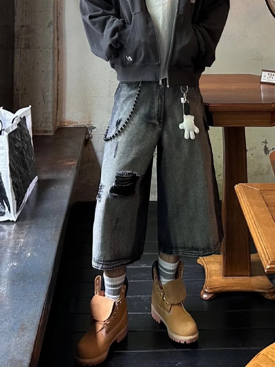 Shorts in denim da uomo American High Street con sfumature scure e strappi, pantaloni estivi larghi a gamba larga stile hip hop, jeans casual a sette ottavi