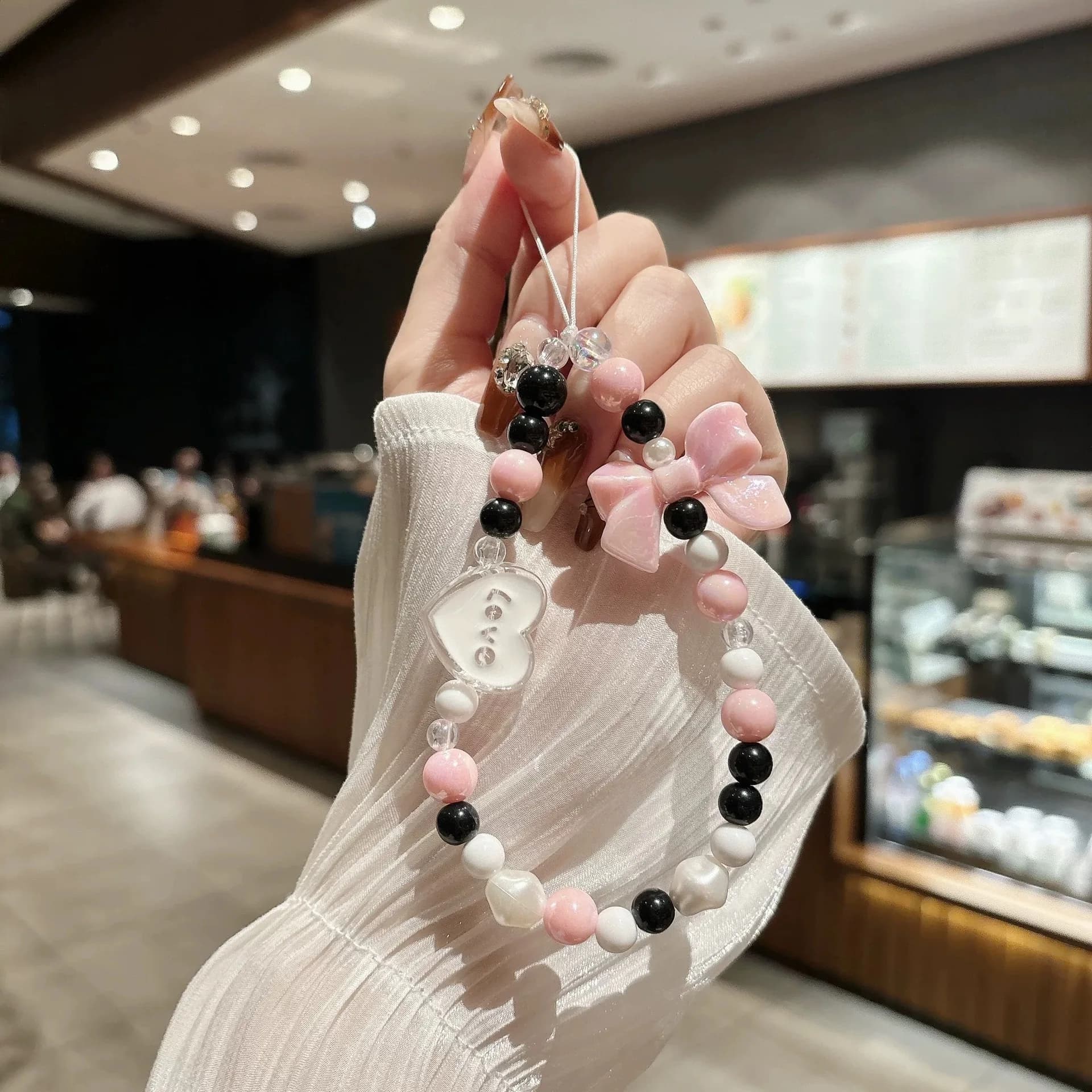 Korean girl pink bow bead bracelet simple portable hand rope lanyard mobile phone case mobile phone lanyard bead chain