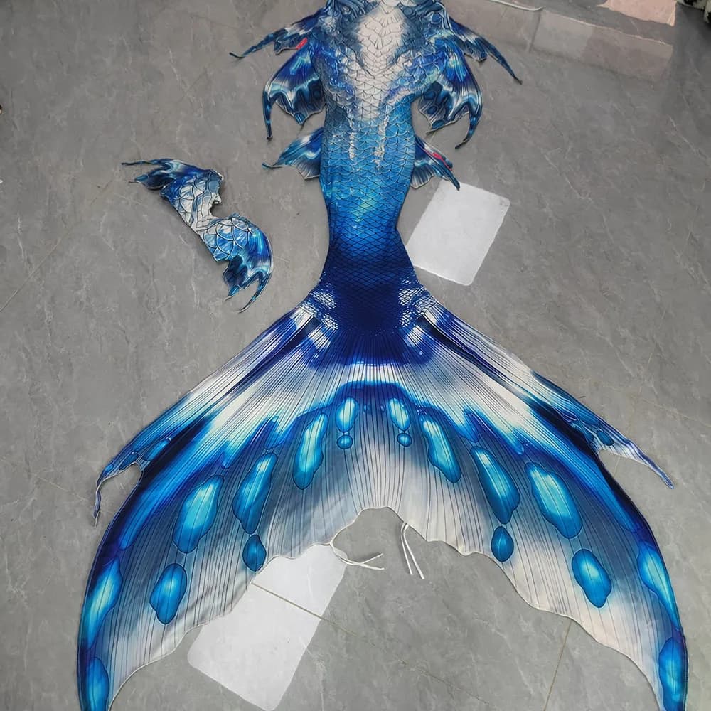 Tailored mermaid swimsuit with original colored mermaid tail, aquarium diving show wearing an adult mermaid tail