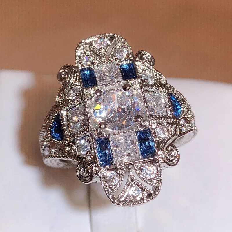 Nuovo anello esagerato di lusso con topazio e zaffiro, motivo floreale, accessori scavati per le donne, gioielli per feste di compleanno