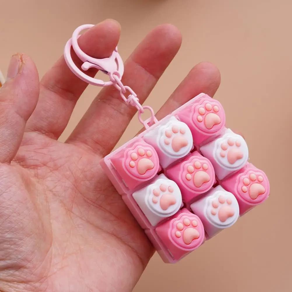 Portachiavi con tastiera a 9 tasti a forma di zampa di gatto, giocattolo antistress con pulsanti meccanici, giocattolo sensoriale per la decompressione per adulti e bambini, per alleviare lo stress