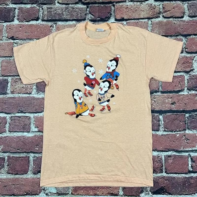 Maglietta carina di pattinaggio su ghiaccio con pinguini dei cartoni animati vintage anni '80 Xl