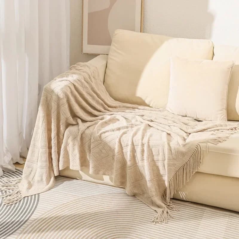 Coperta lavorata a maglia con nappa Coperta piccola jacquard alla moda Coperta casual americana a forma di diamante per pisolino da viaggio sul letto di casa