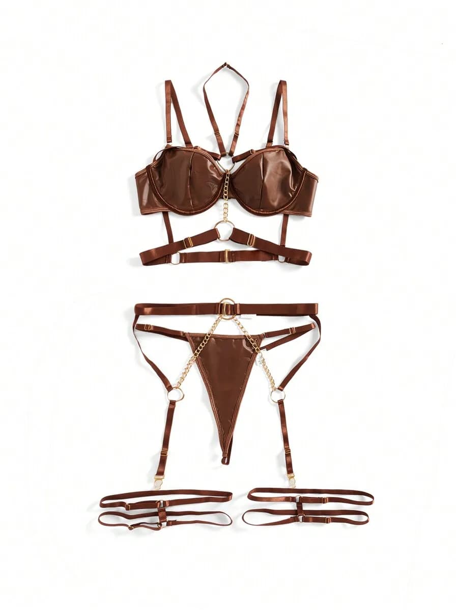 Set reggiseno con ferretto in pelle verniciata e giartiera con dettagli a catena