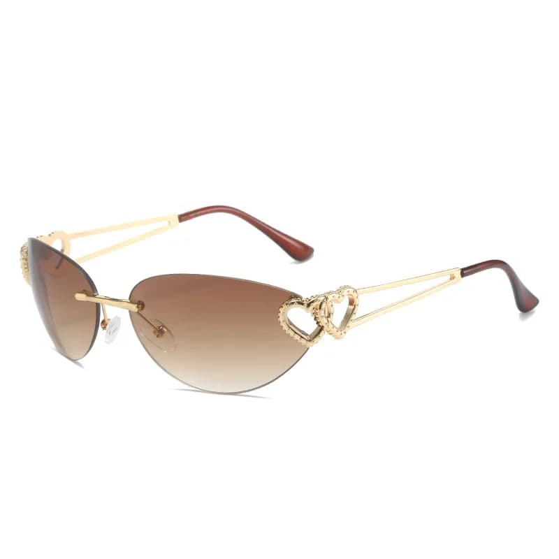 Luxury gold metal rimless frame paired with gradient brown lenses. Hollow double heart decorations adorn the temples, matched with slender golden arms and tortoise brown ear tips. Romantic feminine design, perfect for beach trips and elegant daily