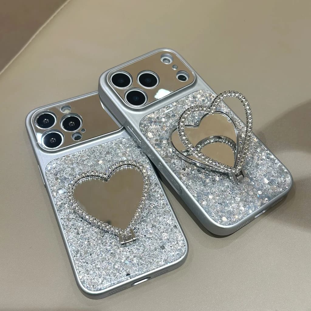 Squisita Cover Protettiva per iPhone 17 16 15 14 Pro Max con Specchio Trucco a Cuore in Paillettes Argento Lucido e Supporto Integrato
