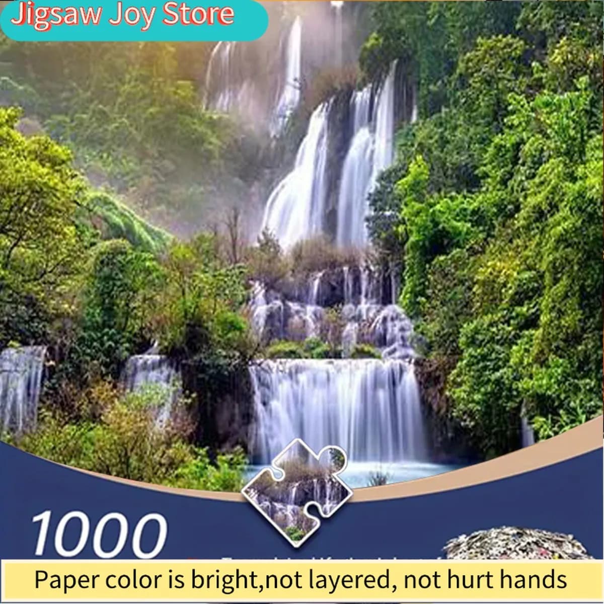 Un puzzle da 1000 pezzi per adulti con cascate che scendono verso il basso nelle montagne, avvolte da verde e luce solare. Ideale