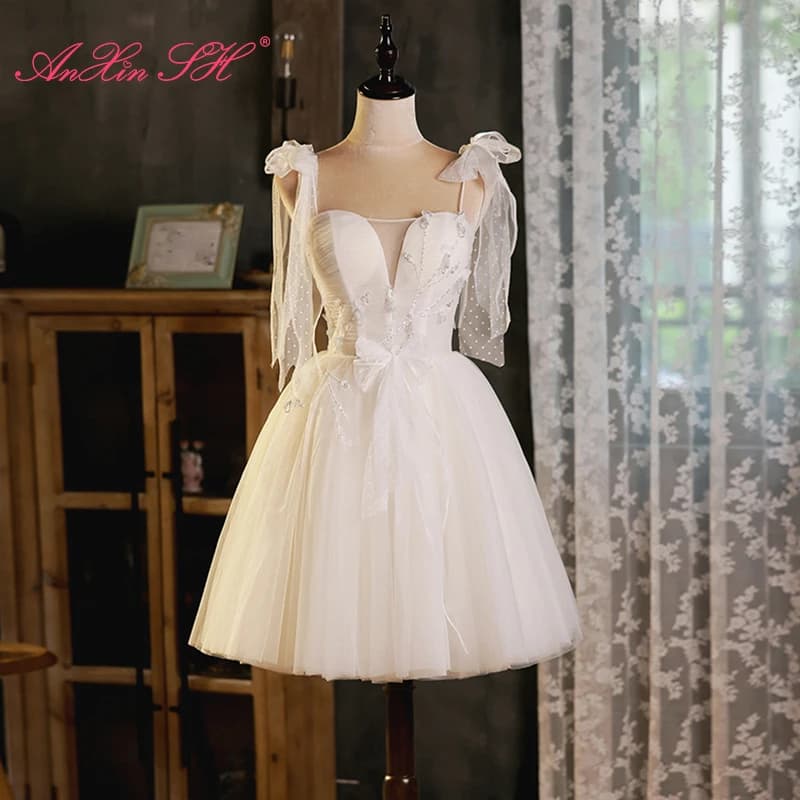 Abito da sera AnXin SH da principessa, bianco, in pizzo floreale, con spalline sottili, perline, fiocco e cristalli, personalizzabile, vestito bianco corto