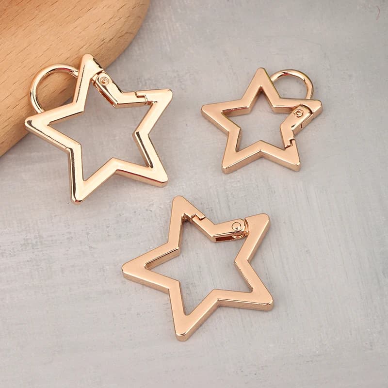 Chiusura a molla a forma di stella cava Moschettone in metallo Portachiavi Borsa Clip Gancio Catena per cani Connettore fibbia Accessori per la creazione di gioielli fai-da-te