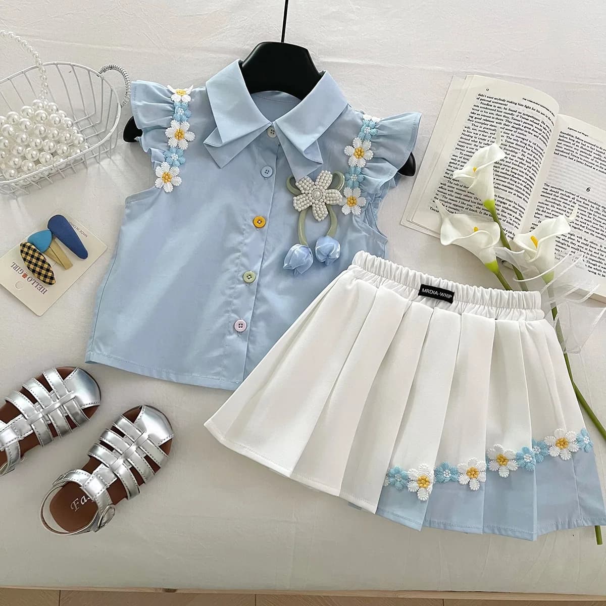 Set da ragazza 2025 Estate nuovo bambino fiore manica corta Top elastico in vita gonna a pieghe set da due pezzi abbigliamento per bambini