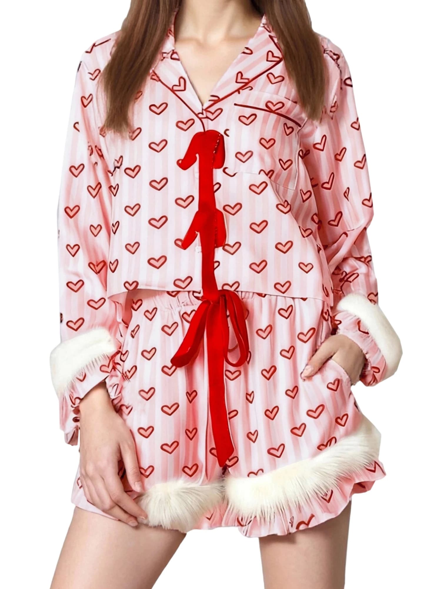 Comfortable women's pyjamas set with pretty heart print and synthetic fur finishes, with long sleeved top with V neckline and bow on the front