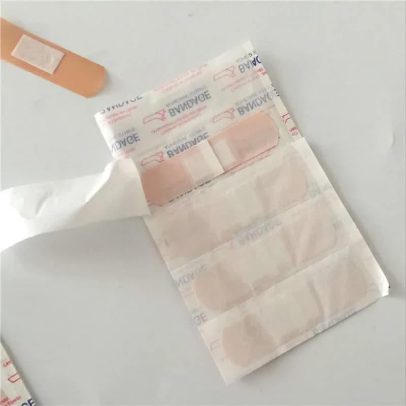 100 Pz/set PE Cerotto Pelle Ferita Medicazione Patch Nastro Traspirante Bende Adesive per Primo Soccorso Gesso Woundplast Kit