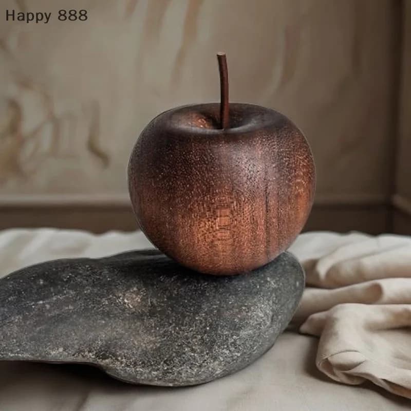 Un diffusore di oli essenziali in legno a forma di mela, ideale per la decorazione di casa, bagno o auto