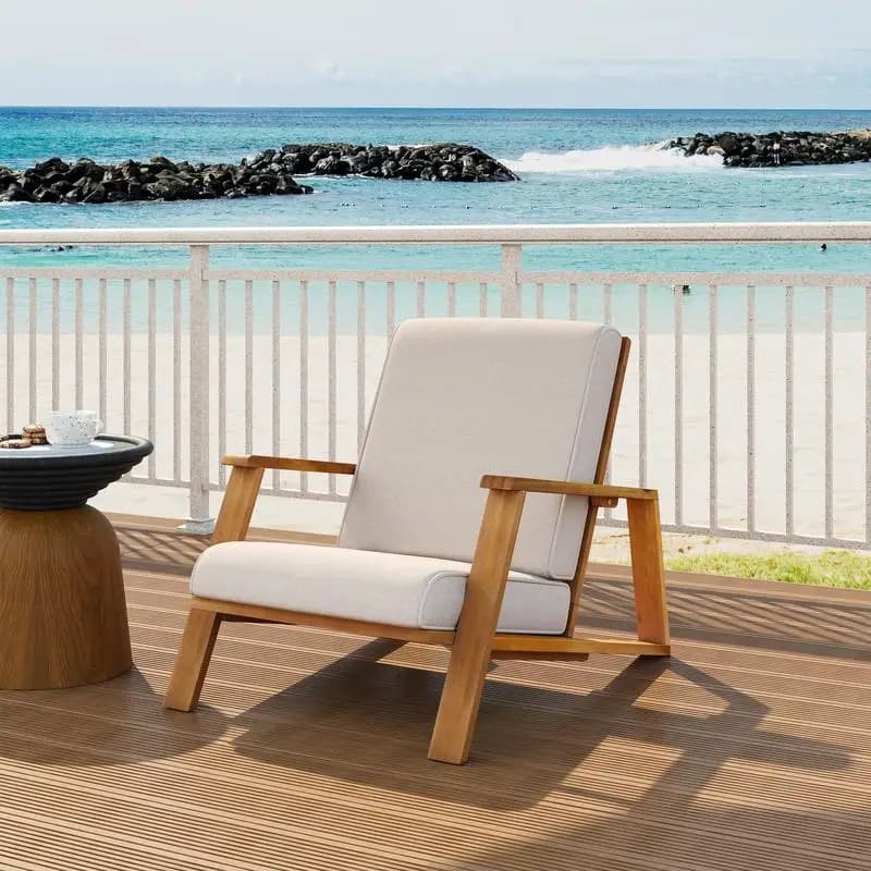 Outdoor club chair with beige cushion and acacia teak structure for garden seating
