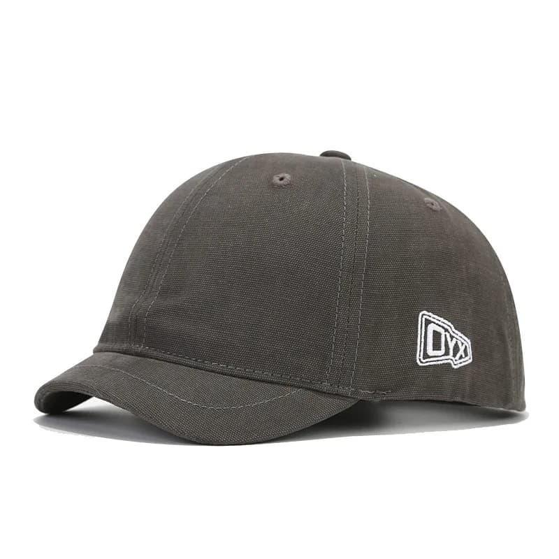 The fashionable and casual short-brimmed embroidered arrow-shaped letter "OYX" baseball cap is suitable for outdoor activities.