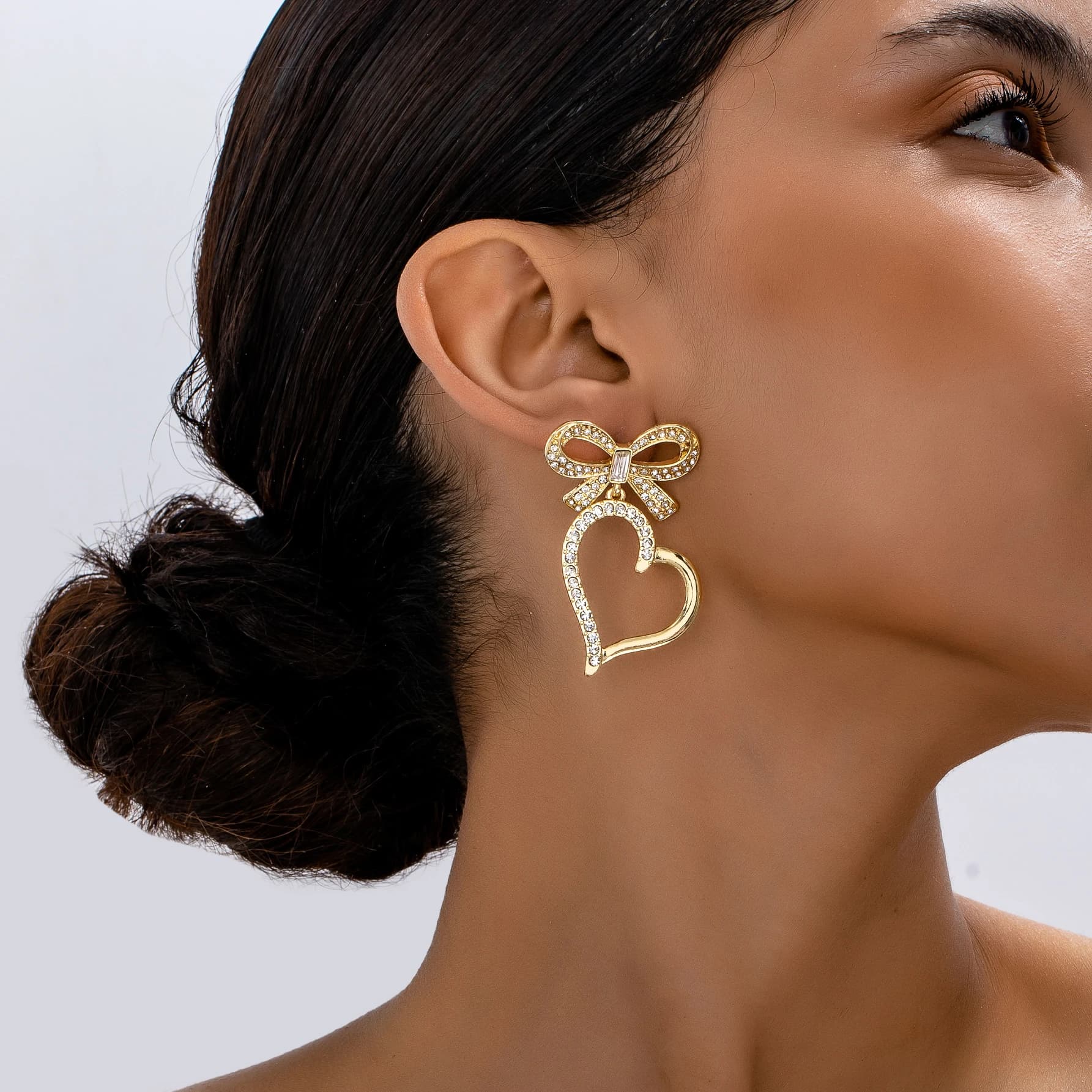 Exaggerated European American style luxury metal inlaid with crystal stone bow and love combination earrings travel jewelry