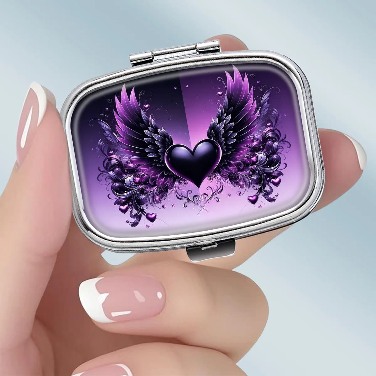 1PC compact 2-compartment square metal pill box, featuring a romantic gothic design with a purple winged heart theme, portable decorative vitamin storage box, or a unique gift for your wallet
