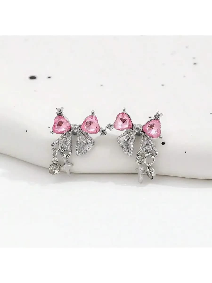 Orecchini pendenti con fiocco in strass rosa per donna
