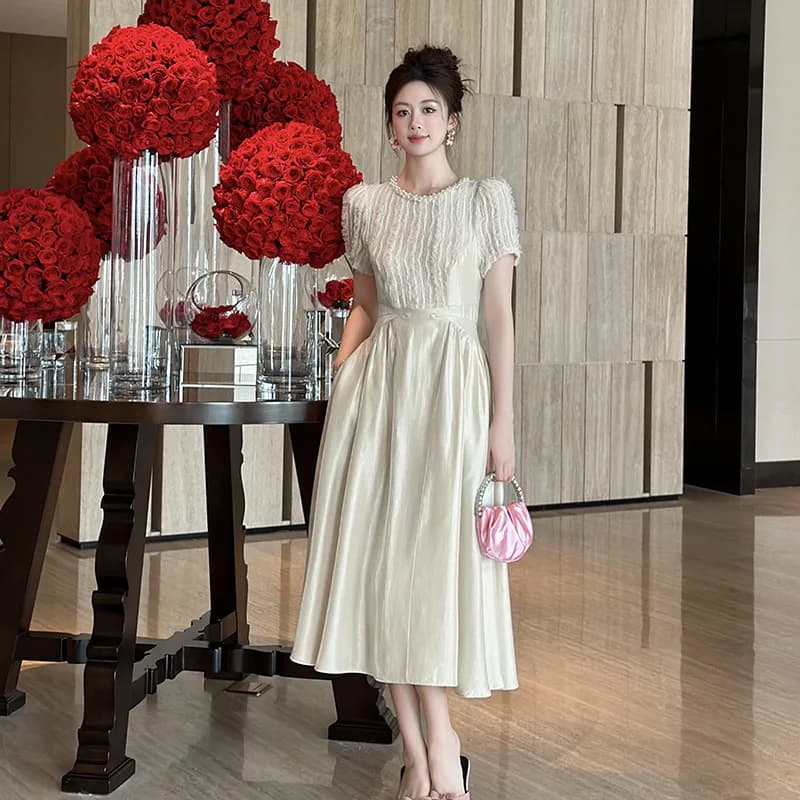 Abito coreano con maniche a sbuffo da donna, nuovo modello estivo 2026, gonna lunga a pendolo elegante e snellente in vita 45177