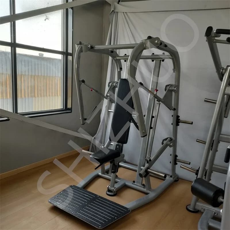 Exercise machine with seat chest press loaded with free weight plate for bodybuilding equipment training