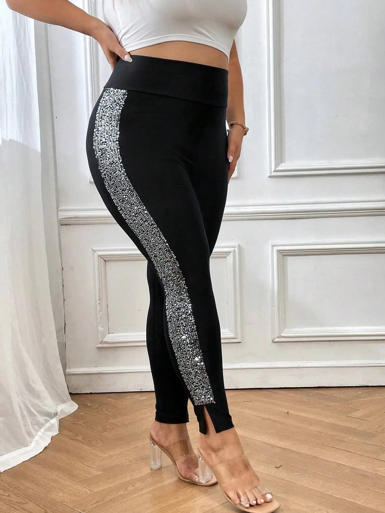 Inoltre leggings con orlo diviso con paillettes a contrasto
