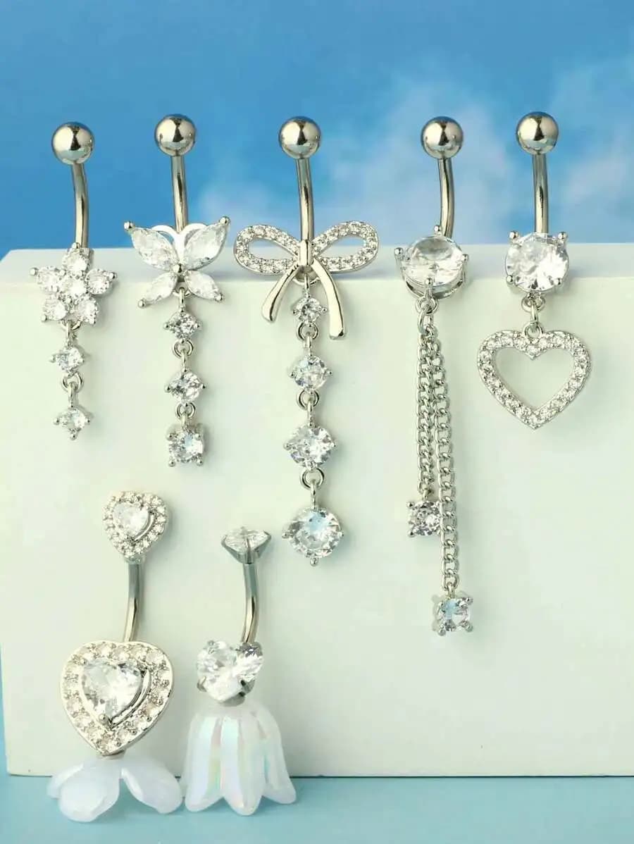 7 pezzi di anelli da ombelico pendenti in cristallo color argento 14G con ciondoli a forma di farfalla, cuore, fiore e fiocco per gioielli da piercing all'ombelico da donna