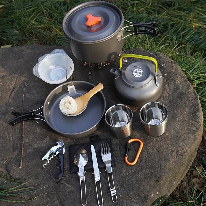 Set of pots with teapot, outdoor tools, set of camping pots, portable cutlery sets, pot and kettle.
