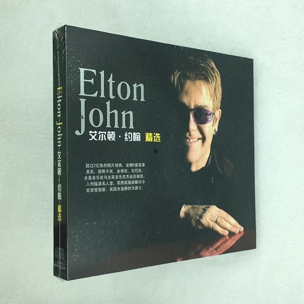 Collezione CD dei migliori successi di Elton John, classica musica pop e rock con pianoforte, brani senza tempo per fan e amanti della musica.