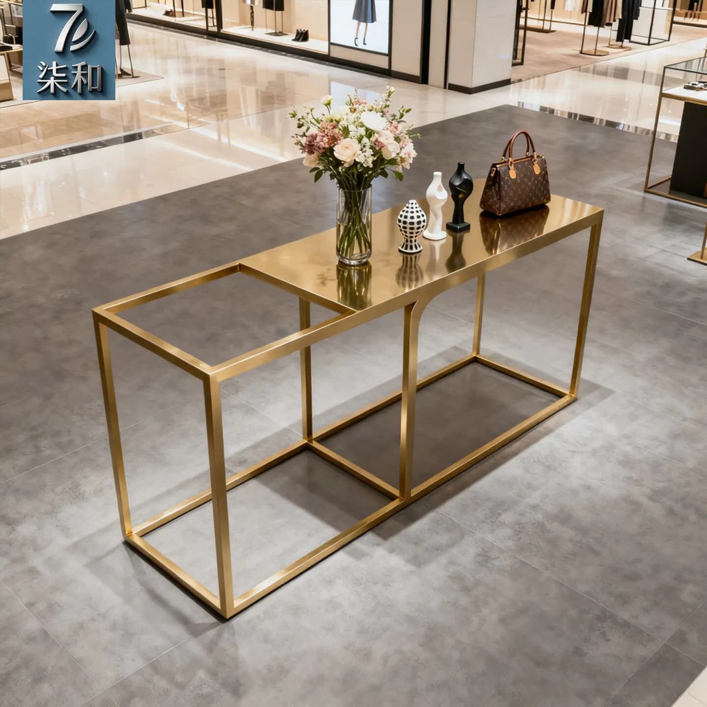 Tavolo espositivo per negozio di abbigliamento in acciaio inossidabile, lusso leggero, con acqua a flusso continuo Zhongdao, tavolo espositivo creativo per prodotti, borsa per scarpe