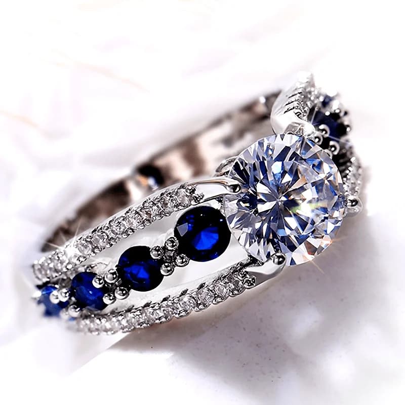 S925 sterling silver ring set with a 2-carat moissanite main stone, with blue fused aluminum oxide on the sides, suitable for unisex daily wear, party and banquet gift, unisex fashion ring, party accessory