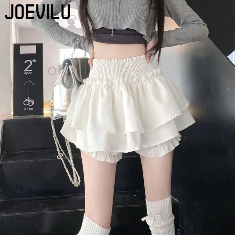 Gonna bianca stile preppy Pieghe elastiche a vita alta Design Gonna torta soffice da donna Pantaloncini incorporati Minigonne stile balletto Hottie