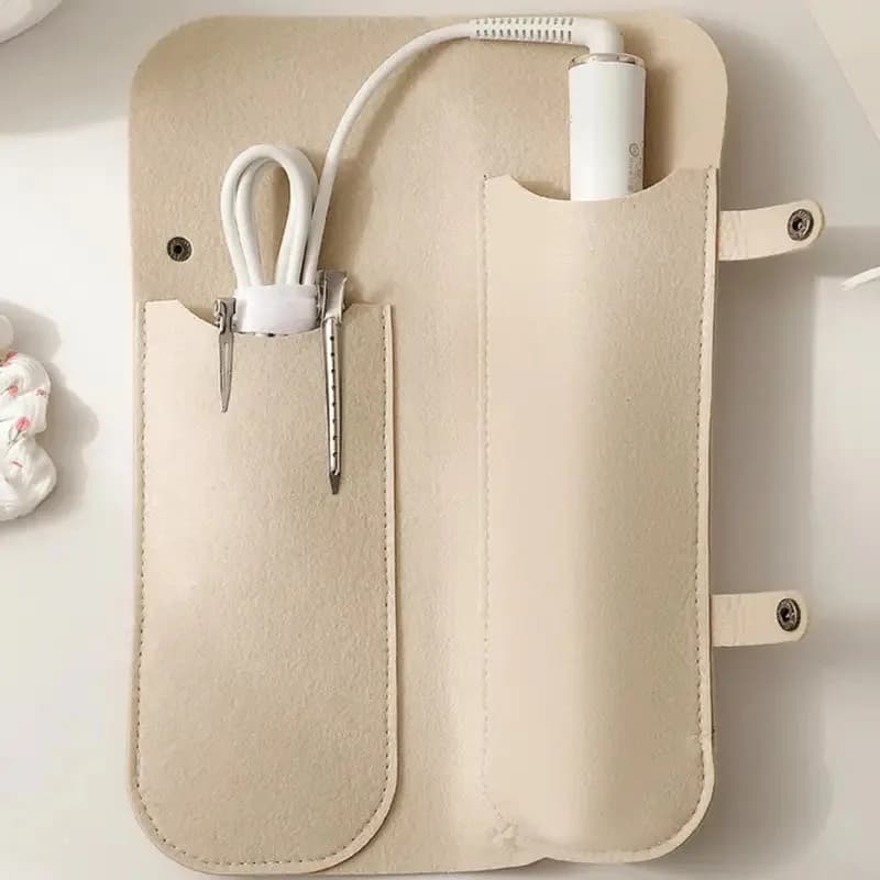 Robust travel organizer with double pocket design, ideal to hold irons for curling, plates, flat combs and hair dryer
