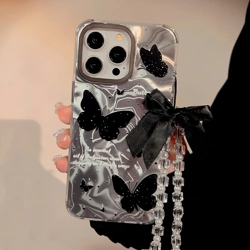 Custodia per telefono di lusso con farfalla nera con cordino Bowknot per iPhone 16 15 Plus 14 13 12 Pro Max Cover posteriore riflettente IMD Capa