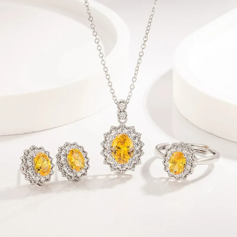 Set di gioielli gialli con zirconi di lusso leggeri europei e americani Collana di fascia alta Orecchini Anello per le donne Accessorio per feste di moda