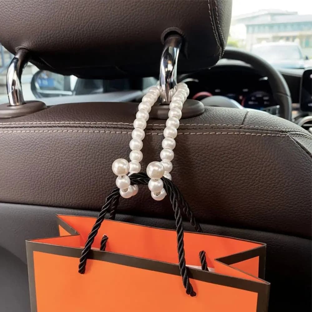 Gancio per auto con fiocco Bowknot Clip per organizzatore per auto con perle in lega durevole Elegante multifunzionale carino gancio per schienale per seggiolino auto Car Styling