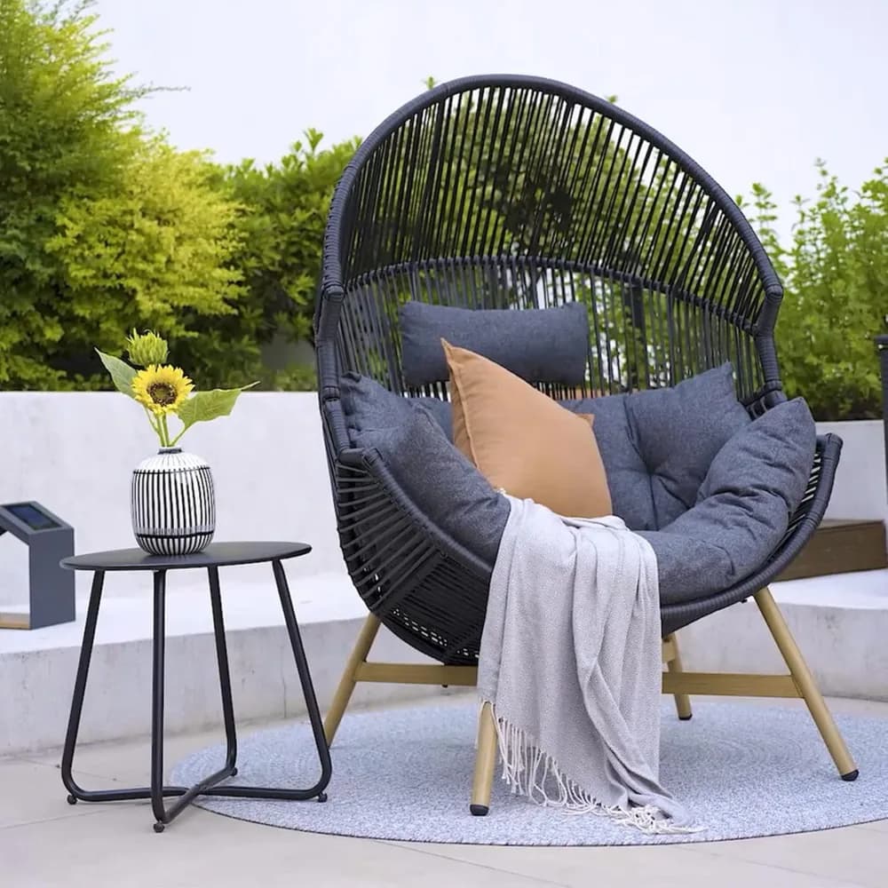 Garden armchair with thick olephine pillow, cocoon chairs, porch, egg chair in outdoor wickers by the pool