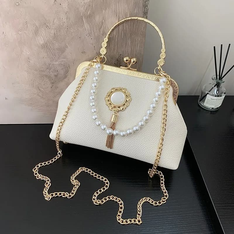 Pochette da sera in metallo a forma di cuore Borsa lucida con borsa a tracolla di lusso a catena di moda per donna