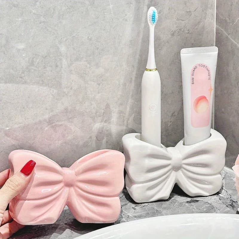 Affascinante portaspazzolino in ceramica a forma di papillon – Soluzione portatile per l'organizzazione del bagno, senza foratura