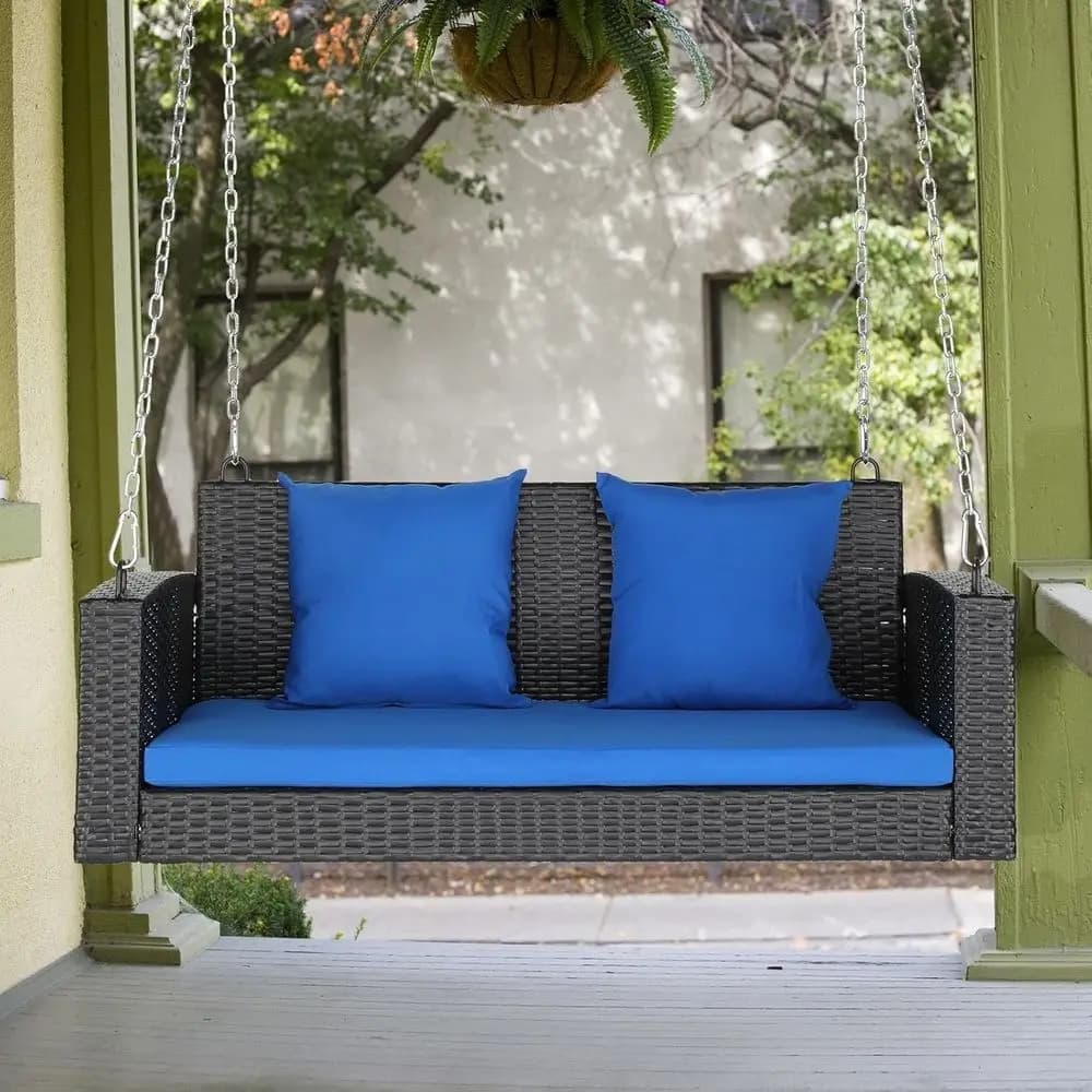 Black rattan rocking chair with blue patio cushion, 49