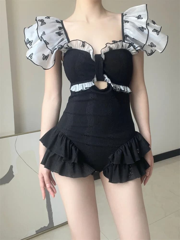 Costume da bagno intero elegante da donna, modello triangolare casual, che nasconde le formi e snellisce.