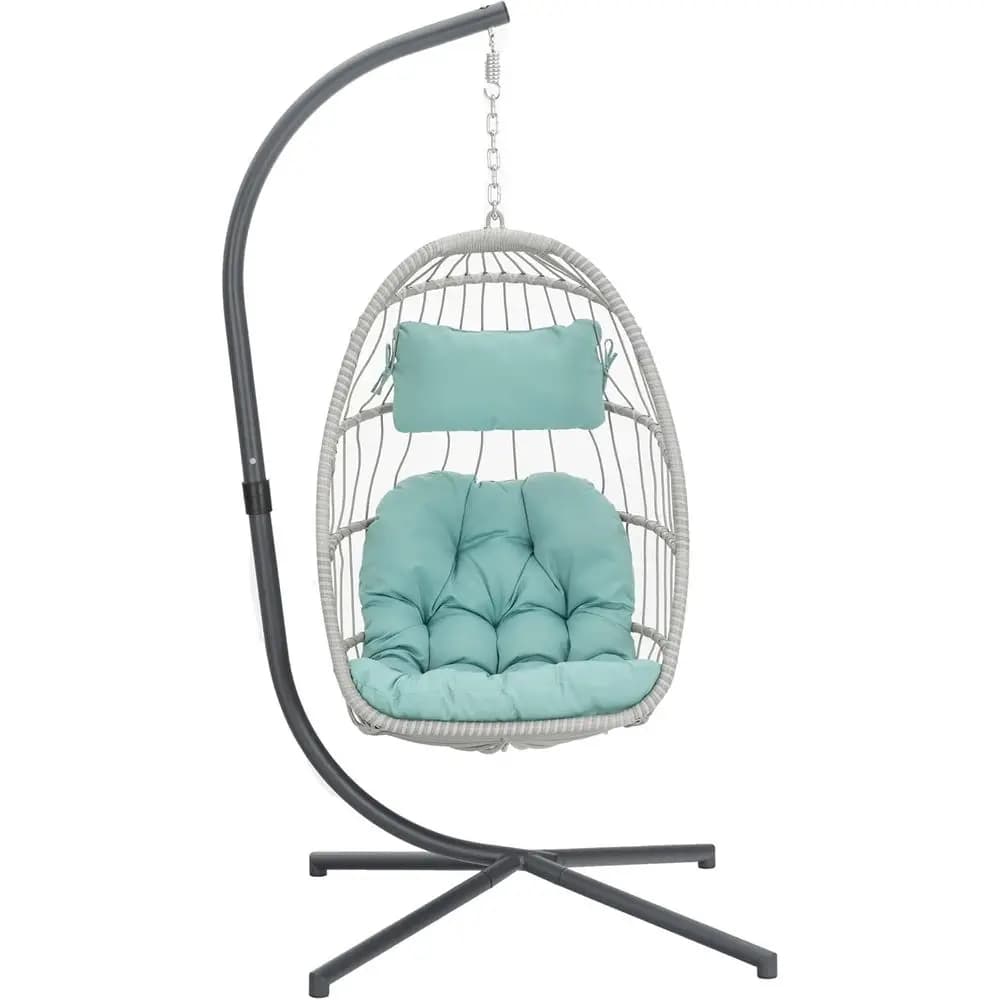 Suspended rocking chair in egg-shaped wickers, blue color, with UV-resistant cushion, for indoor and outdoor use.