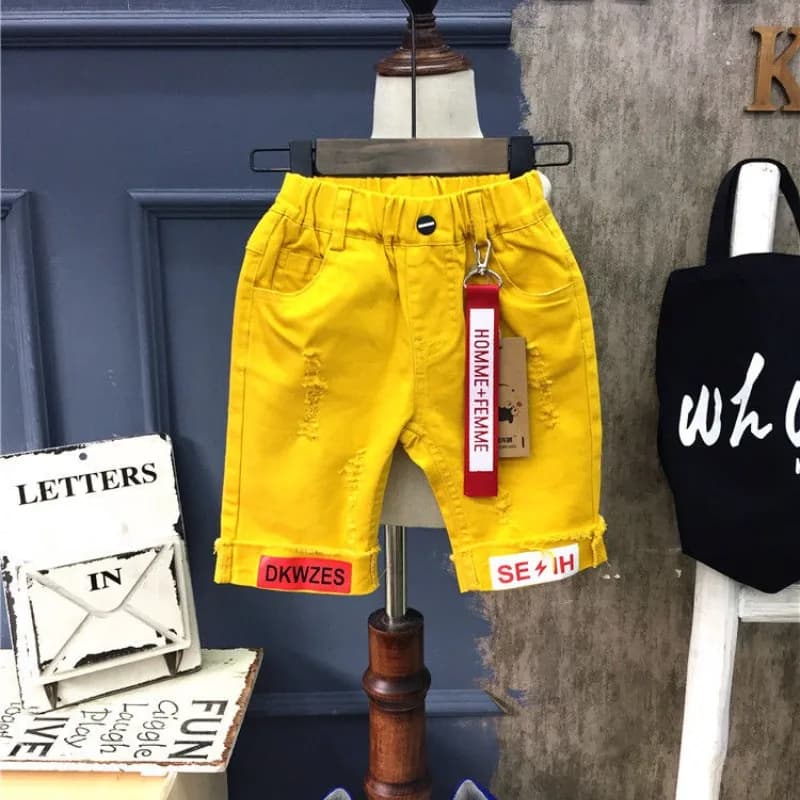Pantaloncini di jeans da ragazzo Nuova versione coreana Abbigliamento per bambini Jeans belli Pantaloni a cinque quarti traforati