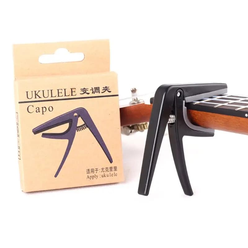 Q39E Capotasto per Ukulele a cambio rapido con sola mano Capotasto per Ukulele professionale a 4 corde