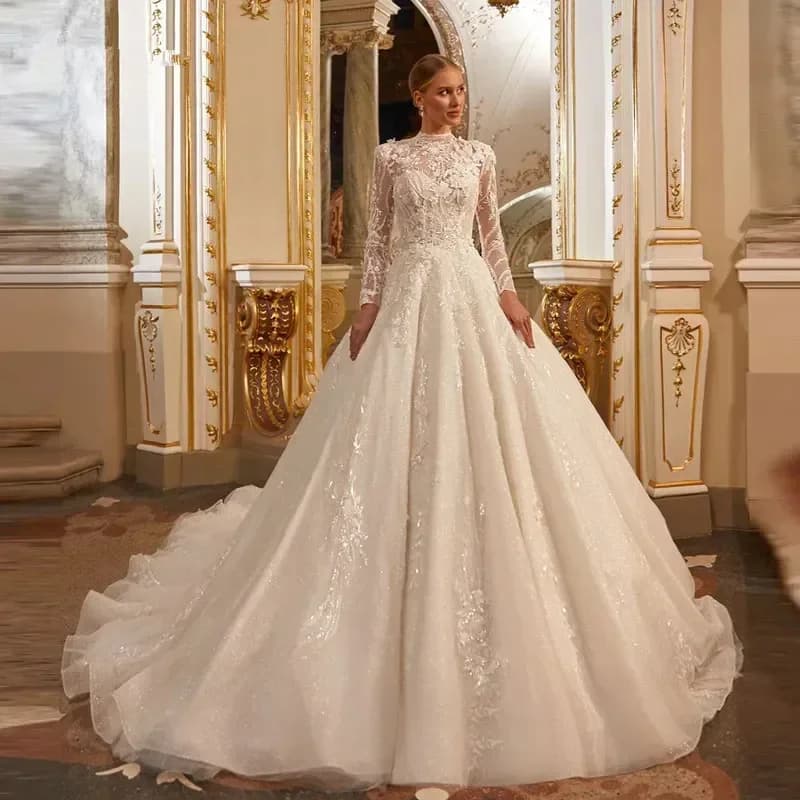 Abito da sposa musulmano a maniche lunghe in pizzo con applicazioni di lusso personalizzate Abito da sposa romantico con collo alto Robe De Mariee