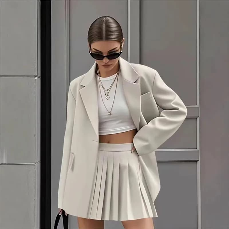 2025 Set da due pezzi casual di nuova moda da donna Gonna a pieghe Abiti da donna Primavera Autunno Office Ladies Abito da pendolarismo in tinta unita