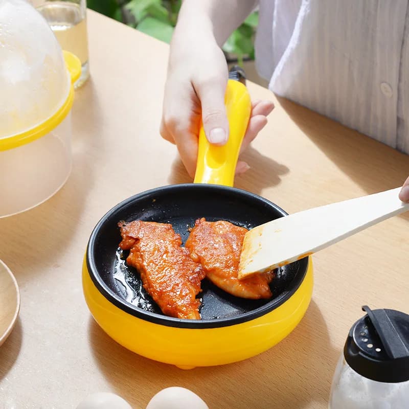 Mini electric steak pan of fried eggs