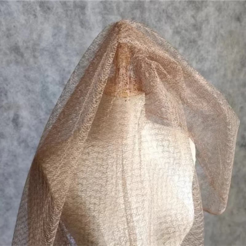 Tessuto a rete giallo terroso con design traforato per modellazione, per cucito fai da te, fodere, accessori per abiti, materiale tessile all'ingrosso al metro