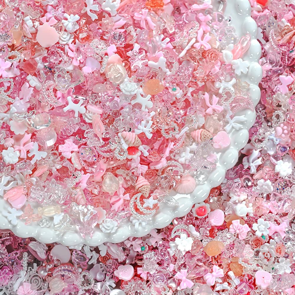 50g/sacchetto Mix di strass per unghie rosa ghiaccio trasparenti a forma di fiore, farfalla, fiocco, luna, cuore, stella, decorazioni per unghie 3D in resina, charm per unghie.