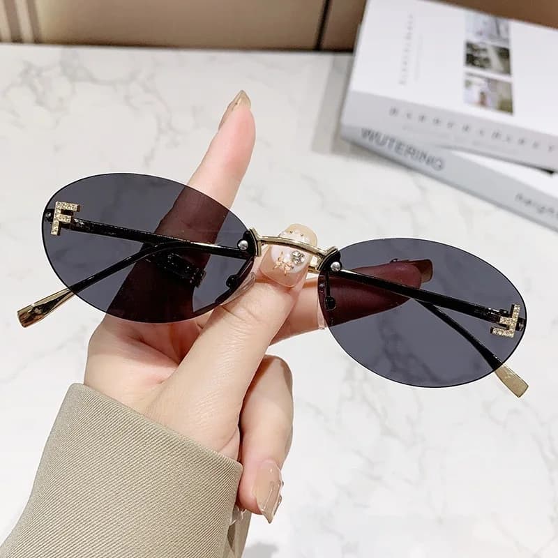 Nuovi occhiali da sole senza montatura con lenti ovali, occhiali da sole alla moda, tendenza europea e americana, montatura piccola decorativa, protezione solare.